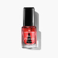 Bottle of LONDONTOWN Bio Peptide Nail Glow in sheer red with a black cap, perfect for a glowing skin aesthetic.