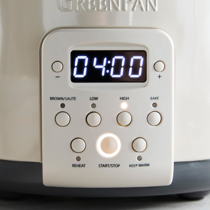 Bistro 4-quart slow cooker in macadamia color, display set to 04:00 with visible mode buttons on front panel.