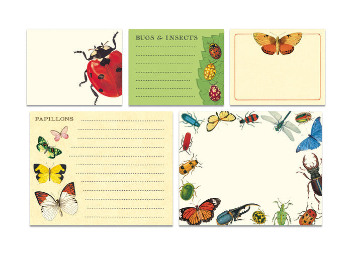 A Cavallini Papers & Co tin with ladybugs and butterflies on it, filled with Bugs & Insects Sticky Notes.