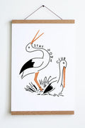 standing bird with sitting bird outlined in black with orange beaks and legs with stay home club text around them