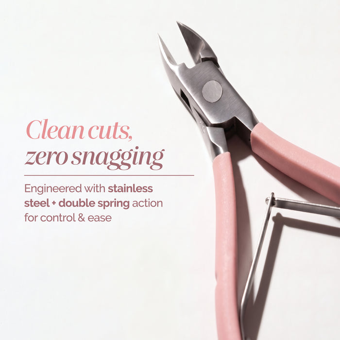The LONDONTOWN Cuticle Nippers – Pink are salon-grade stainless steel nippers featuring pink handles and a double spring, shown here on a white background. This precision tool is designed for clean cuts and zero snagging, making it the perfect cuticle remover for flawless nail care.