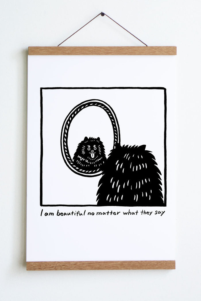 black line drawing in square of back of dogs head looking at reflection in oval mirror with tongue sticking out text underneath reads i am beautiful no matter what they say