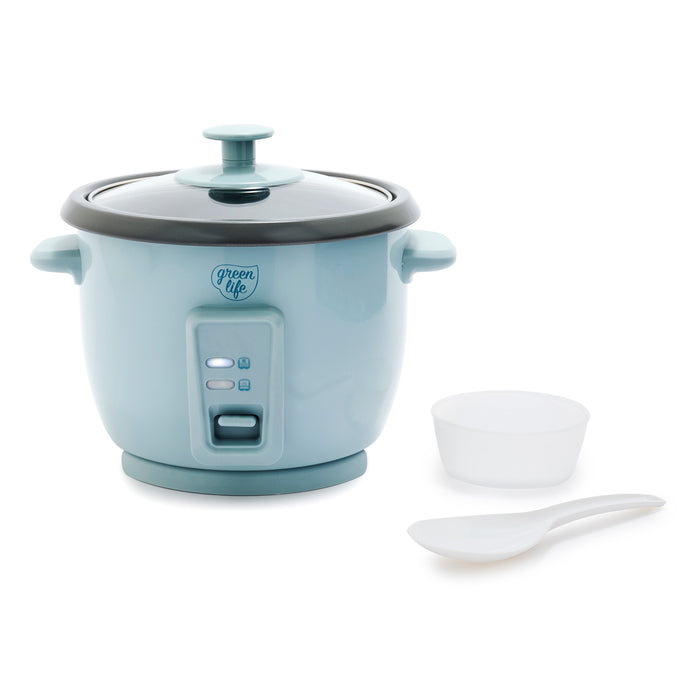 Blue rice cooker with lid, measuring cup, and serving spoon set on a white background.