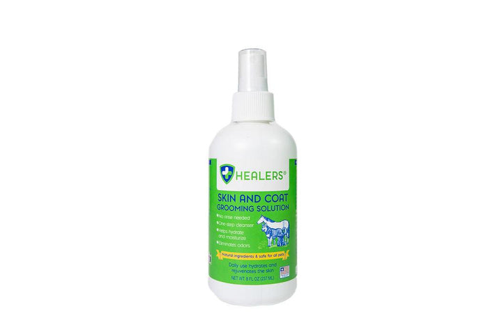 Healers Skin and Coat Grooming Solution bottle with green label, natural pet grooming spray for hydration and odor elimination.