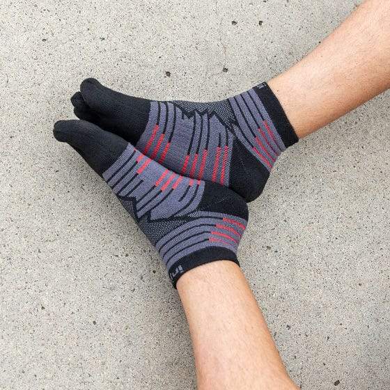 Injinji Toe Socks - Ultra Run Mini Crew - putting on, seated
