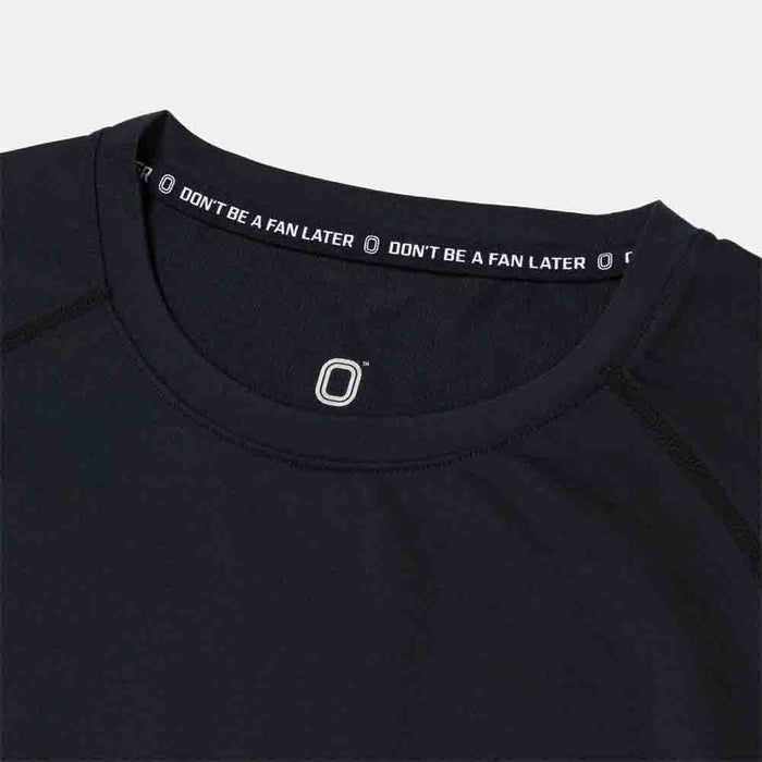 Up close view of emblem on the Overtime Kids' Valid Compression Tee.