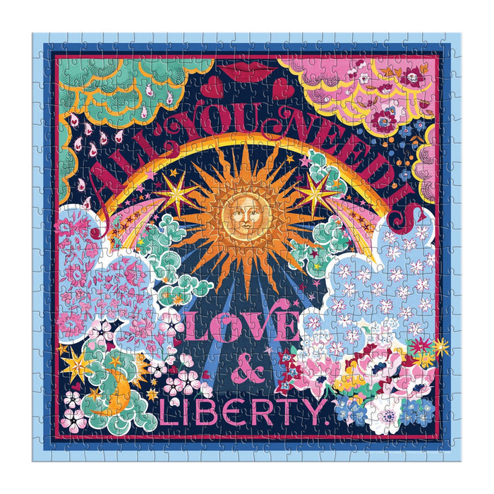 A jigsaw puzzle designed to look like a keepsake box with magnetic closure, titled "Liberty All You Need is Love Puzzle" featuring a colorful, Thorpe print design. It consists of the Liberty All You Need is Love 500 Piece Book Puzzle by Chronicle Books.