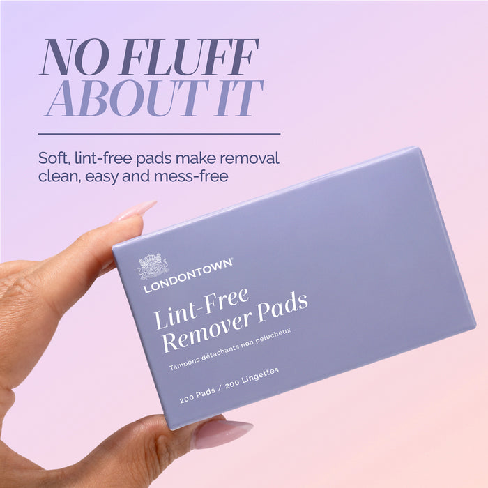 A hand holds a box of LONDONTOWN Lint-Free Remover Pads, with text highlighting their soft, lint-free design for easy and mess-free removal, set against a pastel background.