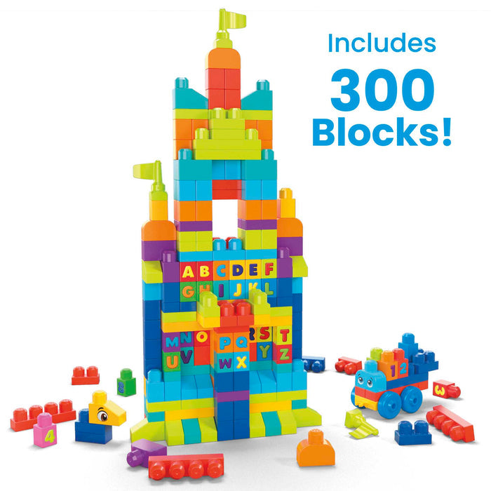 A vibrant tower made with the MEGA Bloks Even Bigger Building Bag by Mega Bloks is shown with extra blocks and a blue car. Text reads “Includes 300 Blocks!” These blocks build fine motor skills and feature letters and numbers.