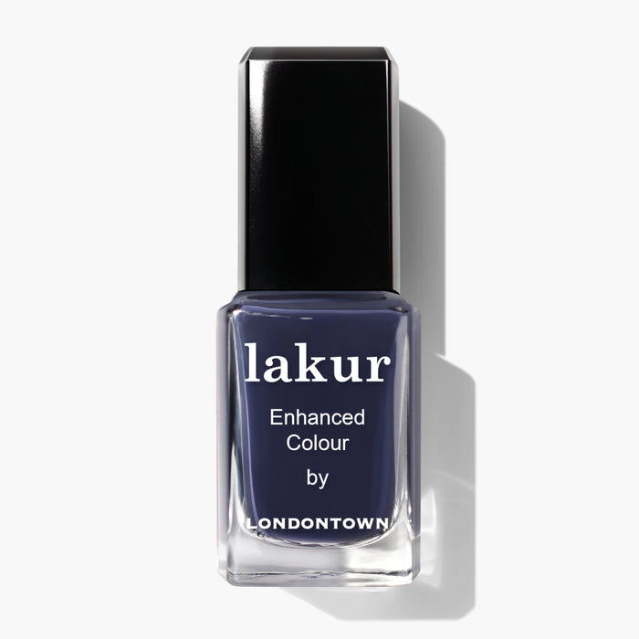 Bottle of Midnight Kiss nail polish by LONDONTOWN in a deep, moody navy blue shade.