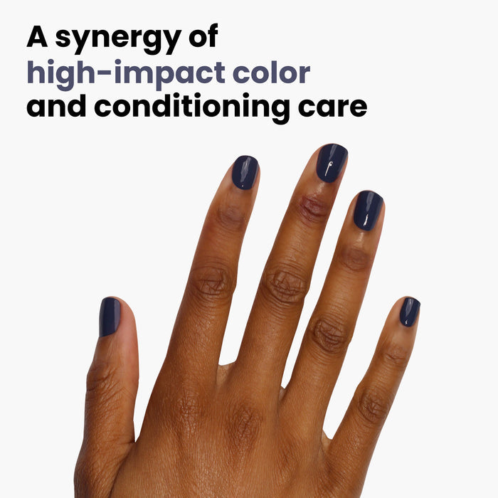 A hand with blue nails is shown on a white background. The text reads, "Midnight Kiss by LONDONTOWN: A synergy of high-impact color and conditioning care.