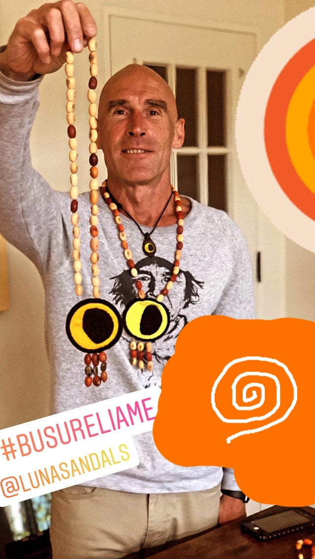 MOON NECKLACE - all proceeds go to the BUSURELIAME PROJECT - held up - Busureliame