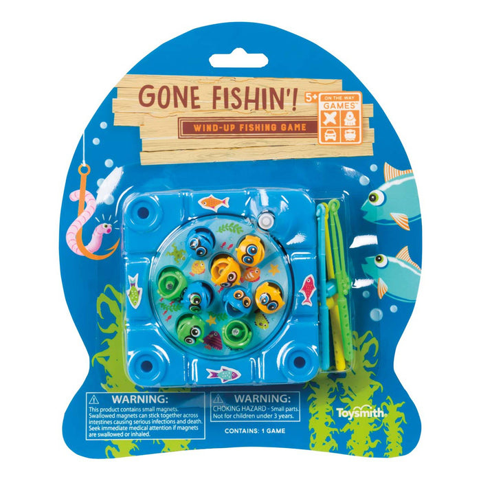 The On the Way Games Gone Fishin' travel game by On the Way Games features small plastic fish in a rotating pond, four green fishing poles, and colorful sea-themed packaging with visible warnings on the front.