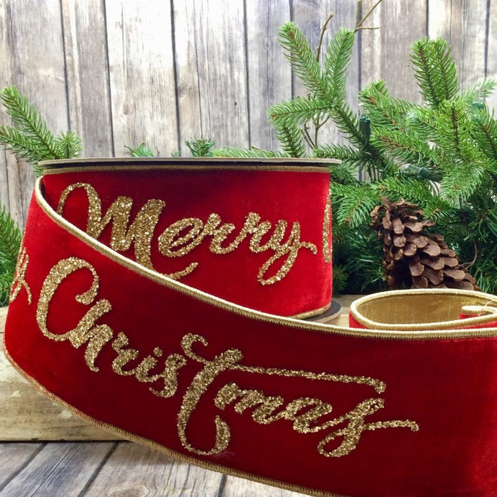 Red Velvet Ribbon with gold glitter on it saying "Merry Christmas" .