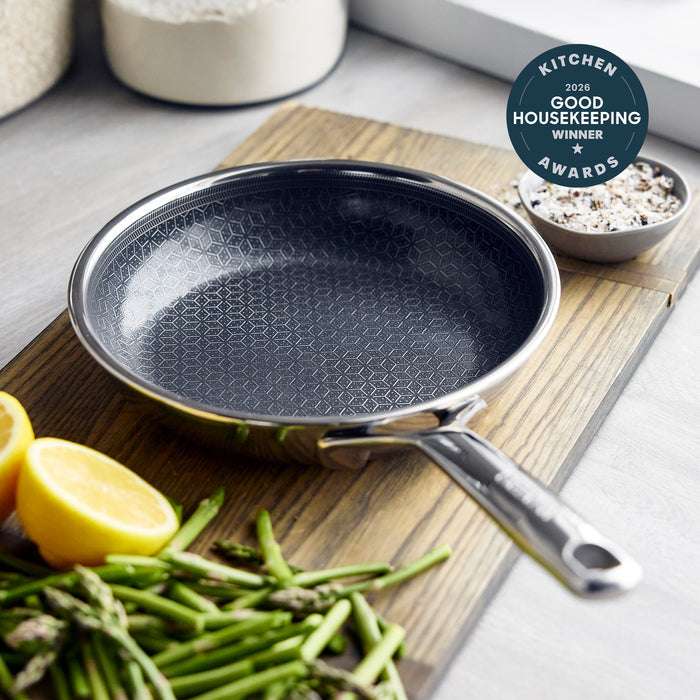 Gray hybrid ceramic nonstick 8-inch frypan with asparagus, lemon slices, salt, and a Good Housekeeping award beside it.