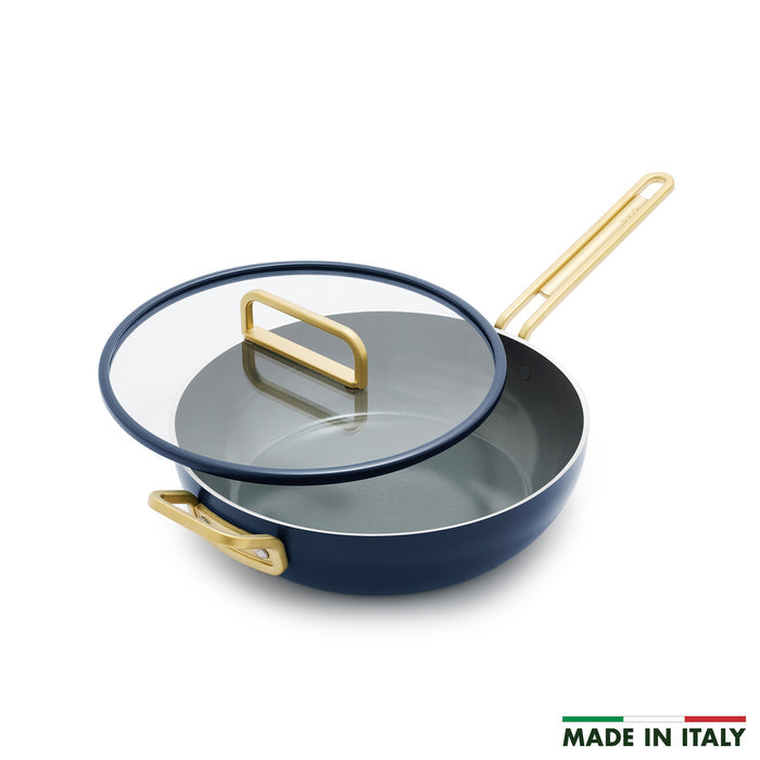 Blue sauté pan with gold handles and matching lid, 4.5-quart size, made of nonstick material.