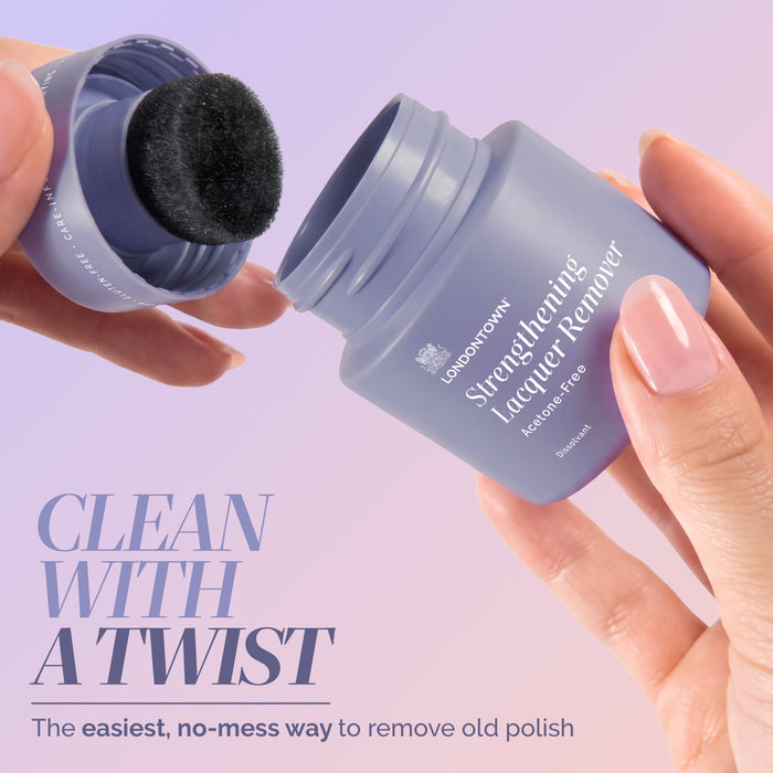 Hand holding a container of LONDONTOWN Strengthening Lacquer Remover Pot, sponge inside; another hand holds the lid. Text reads, “Clean with a twist. The easiest, no-mess way to remove old polish—just dip and twist for a fresh start.”.