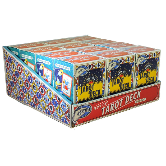 The Tiny Toys Teeny Tiny Tarot Deck display box features multiple mini decks with colorful vintage-style artwork and bold lettering. Perfect for travel, each small box includes tarot cards, with decorative side patterns on the display.