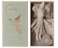A toy mouse in a pink nightgown sitting inside a box with a lid that features a drawing of another toy mouse wearing a crown and the text 'Dream & Tooth Fairy'.