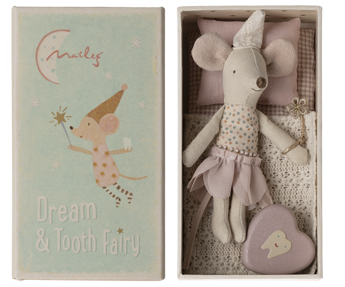 A toy mouse in a pink nightgown sitting inside a box with a lid that features a drawing of another toy mouse wearing a crown and the text 'Dream & Tooth Fairy'.