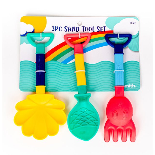 The Toysmith 3PC Sand Tool Set by Toysmith includes a yellow shell-shaped shovel, a green fish tool, and a red octopus rake with multicolored handles, all packaged under a vibrant rainbow-themed design.