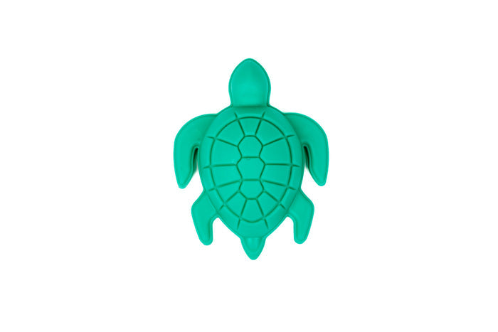 The Toysmith 6pc Set Ship Sand Bucket Set includes a green turtle-shaped plastic mold with a segmented shell design, ideal for beach play or building sandcastles. From Toysmith, shown from above on a white background.