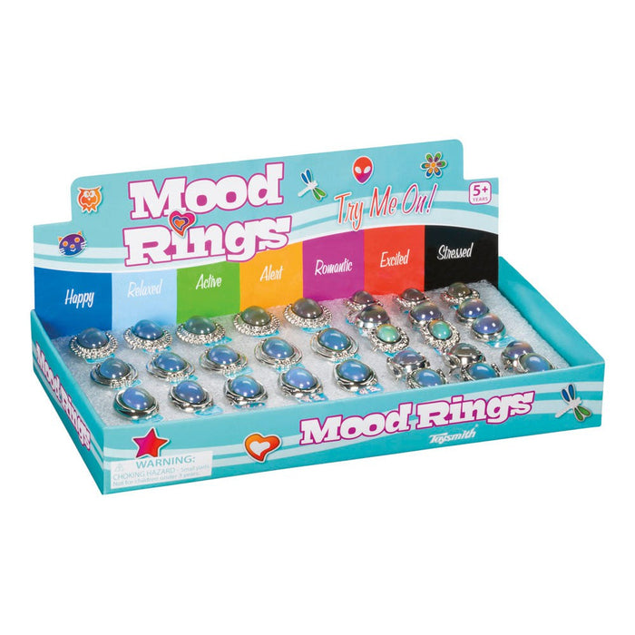 A display box of Toysmith Jumbo Mood Rings features color-changing, adjustable rings by Toysmith that represent emotions like happy, relaxed, and excited. The rings are arranged in rows on a foam insert.