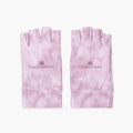 A pair of pink tie-dye UV Gloves by LONDONTOWN, featuring the brand name and logo printed on the back of each glove; these fingerless gloves provide stylish hand protection for everyday wear or can be used as gel padded gloves for added comfort.