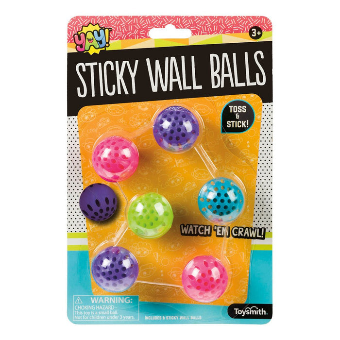 A package labeled YAY! Sticky Wall Balls by YAY! holds six colorful, soft balls that stick to walls for repeated play. The bright, playful packaging features a small parts warning.